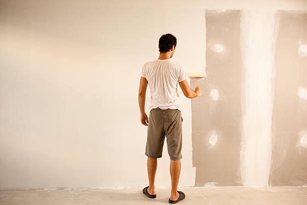 Best Water-Damaged Drywall Repair  in Russell, KY